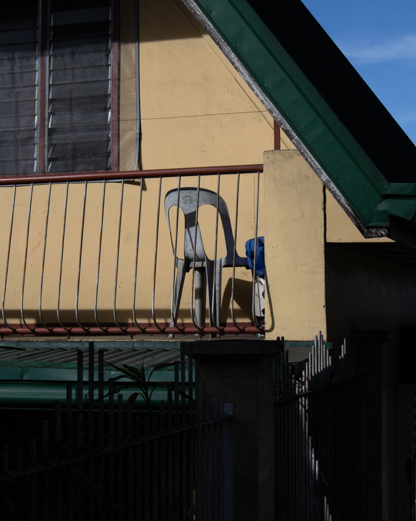 Monobloc chair on balcony