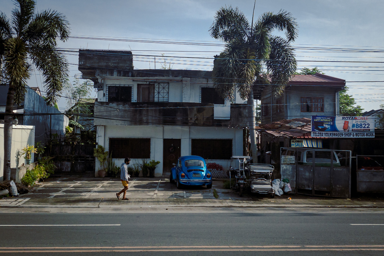 A man walking at Bay, Laguna