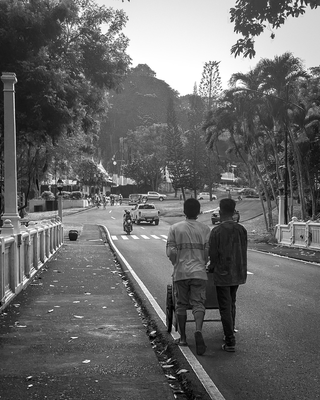 Two workers pushing a wagon